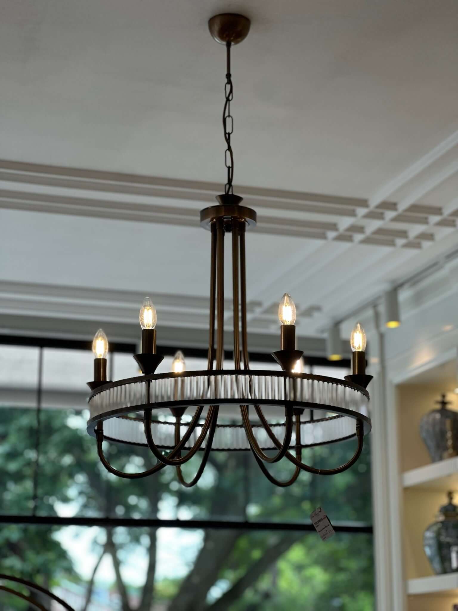 Modern Round Crystal Chandelier showcasing elegant design with candles and intricate details.