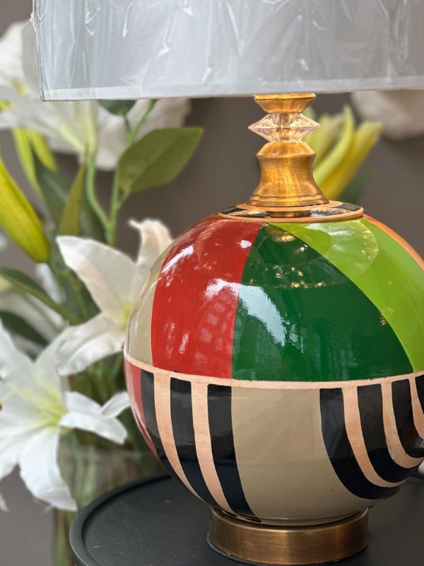 Round multicolor ceramic table lamp hand-painted with bold geometric patterns